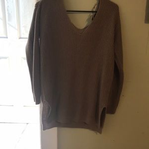 Long sleeve brown shirt .